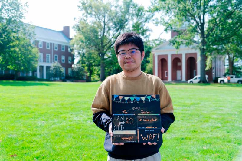 a man holding a sign