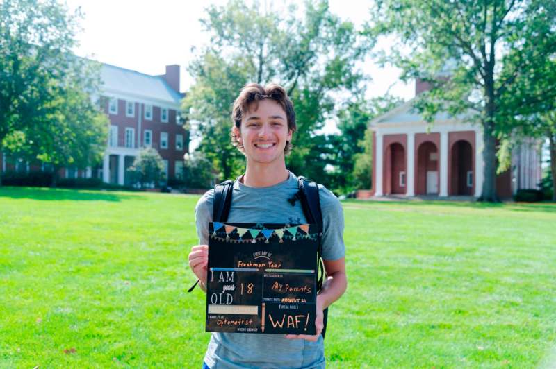 a man holding a sign