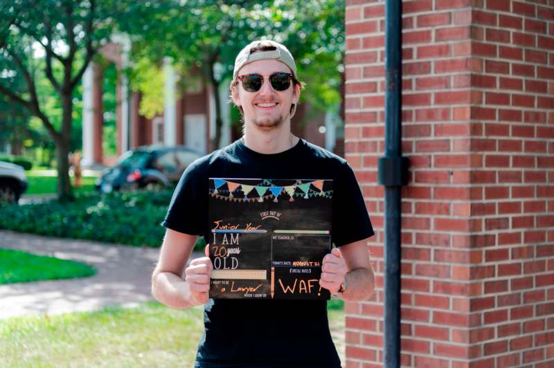 a man holding a sign