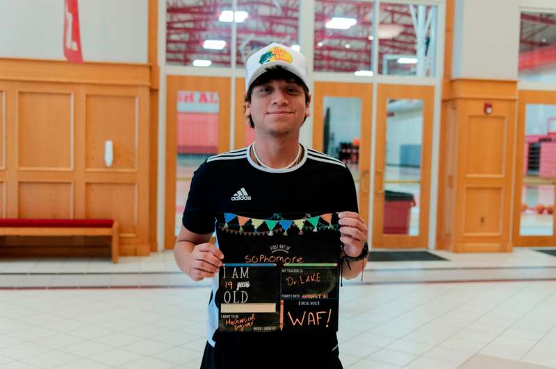 a man holding a sign