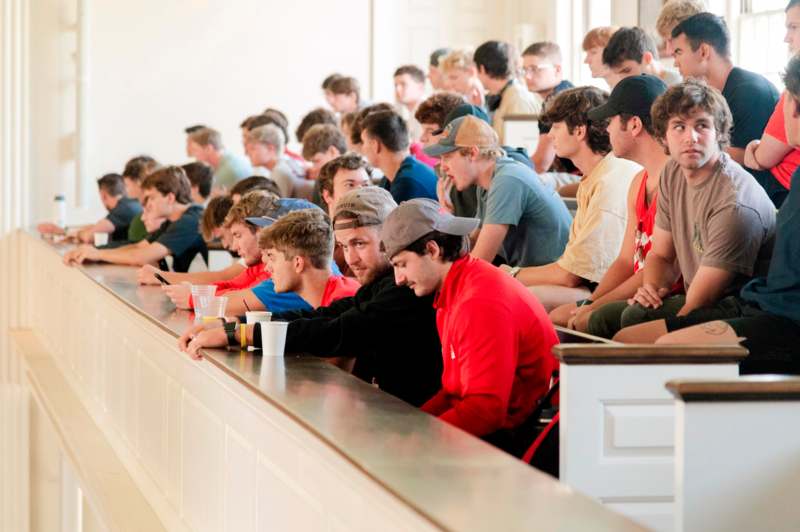 a group of people sitting in a row