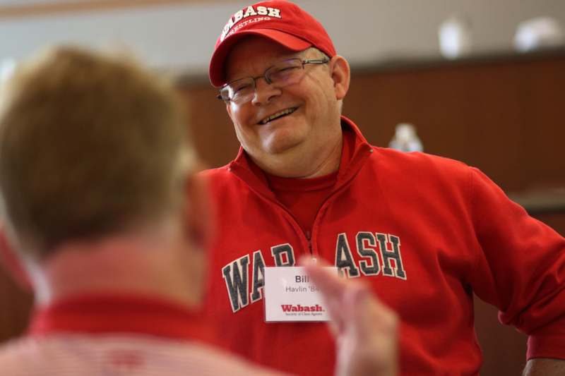 a man wearing a red hat and a red sweatshirt