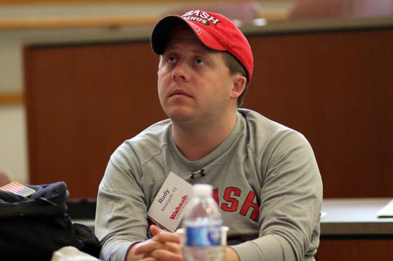 a man wearing a red hat and a badge