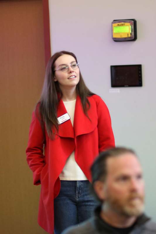 a woman in a red coat