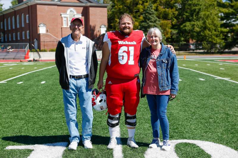 a group of people standing on a football field