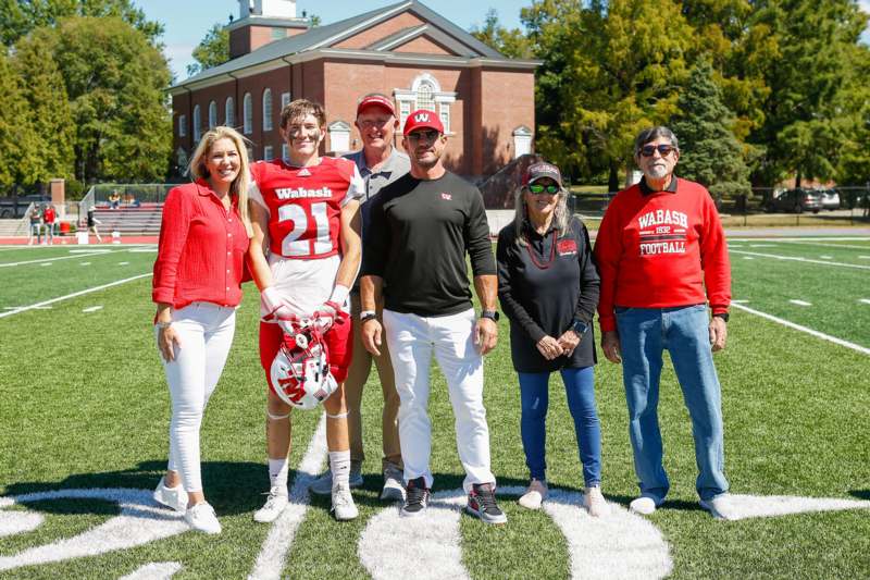 a group of people standing on a football field