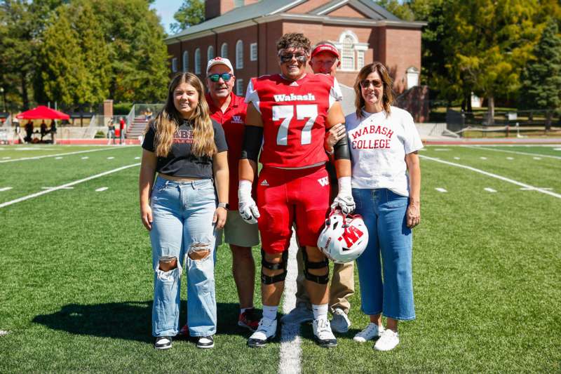 a group of people standing on a football field