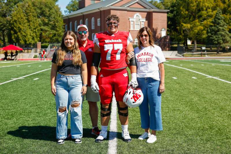 a group of people standing on a football field