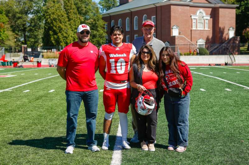 a group of people standing on a football field