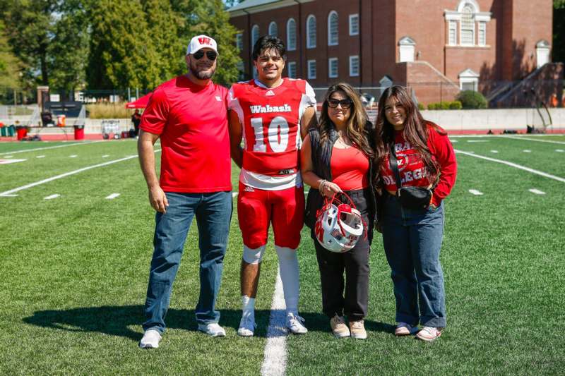 a group of people standing on a football field