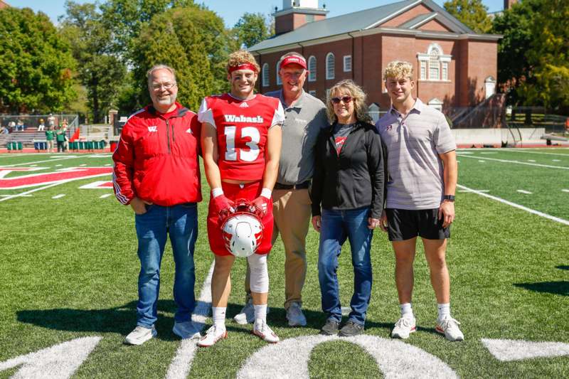 a group of people standing on a football field