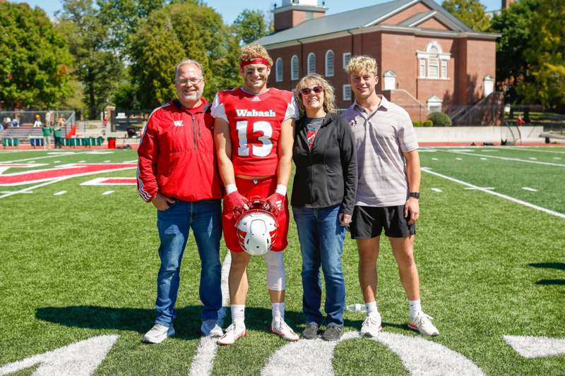 a group of people standing on a football field