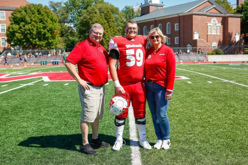 a group of people standing on a football field