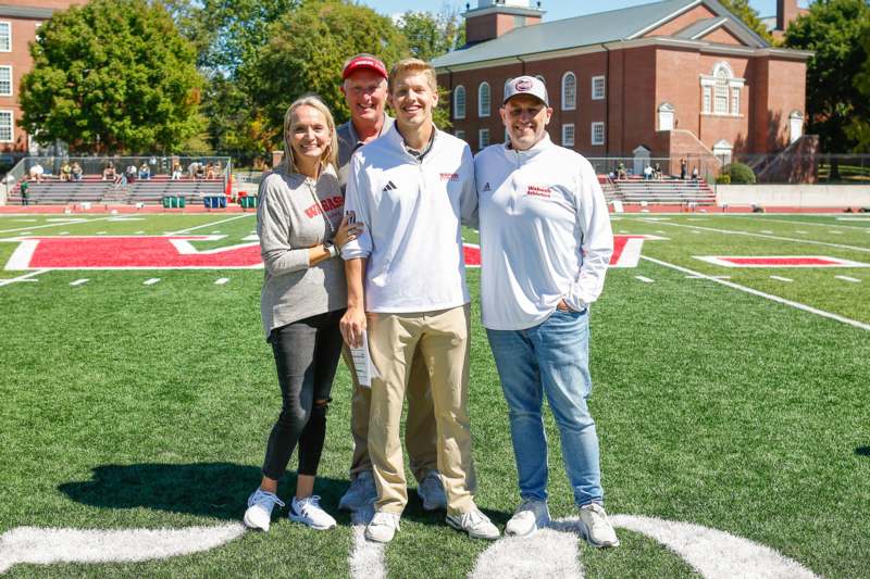 a group of people standing on a football field