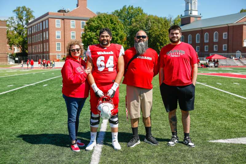 a group of people standing on a football field