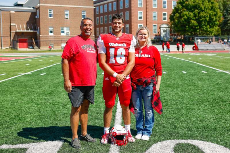 a group of people standing on a football field