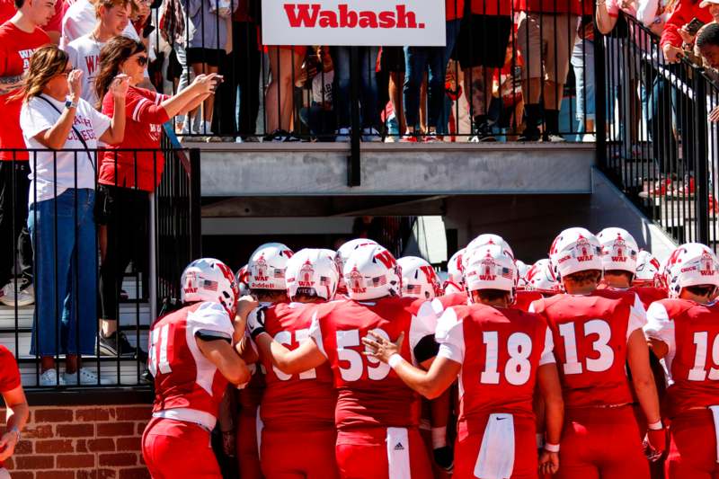 a group of football players in red uniforms