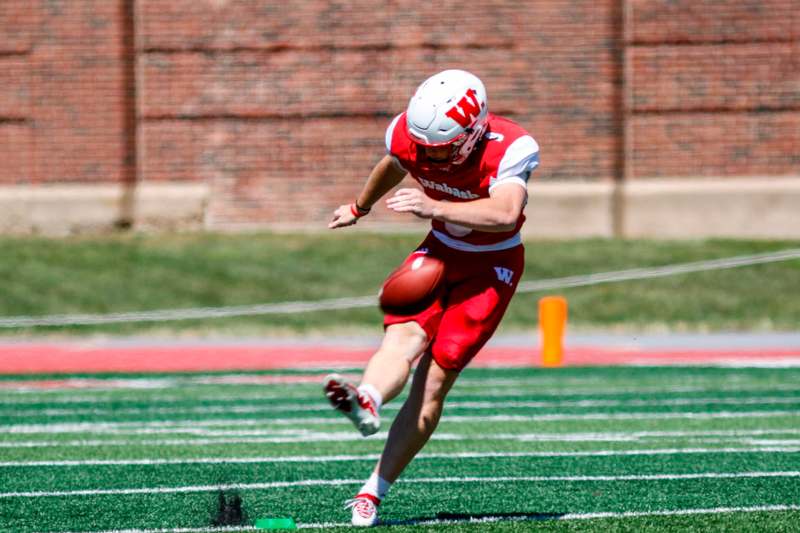 a football player running with a football