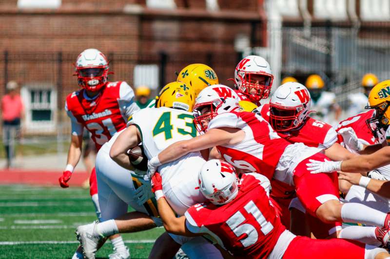 a group of football players on a field