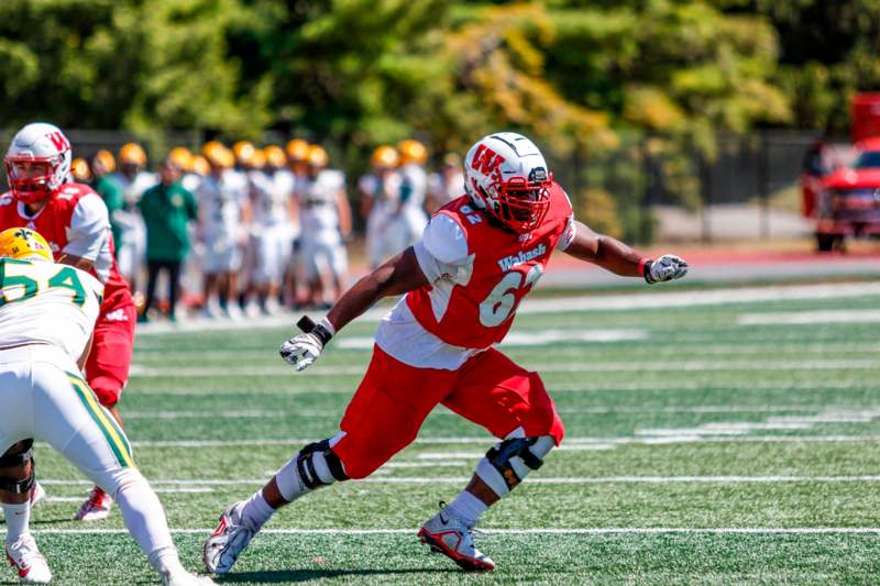 a football player running on a field