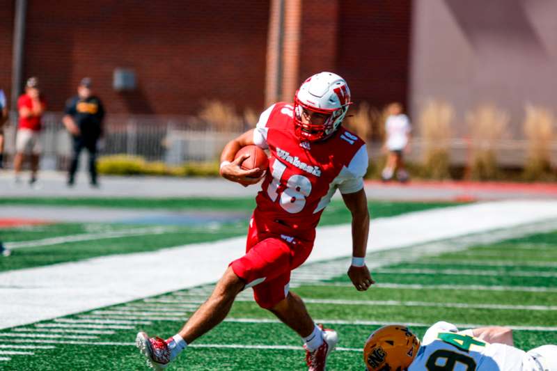 a football player running with a ball