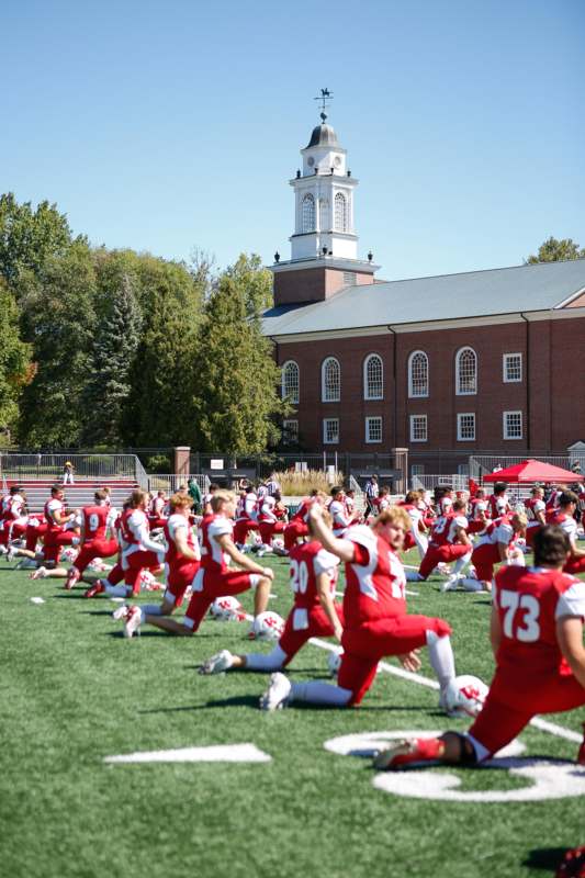 a group of people in a football field