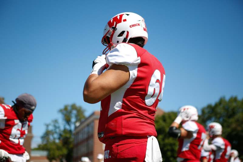 a football player in a red uniform