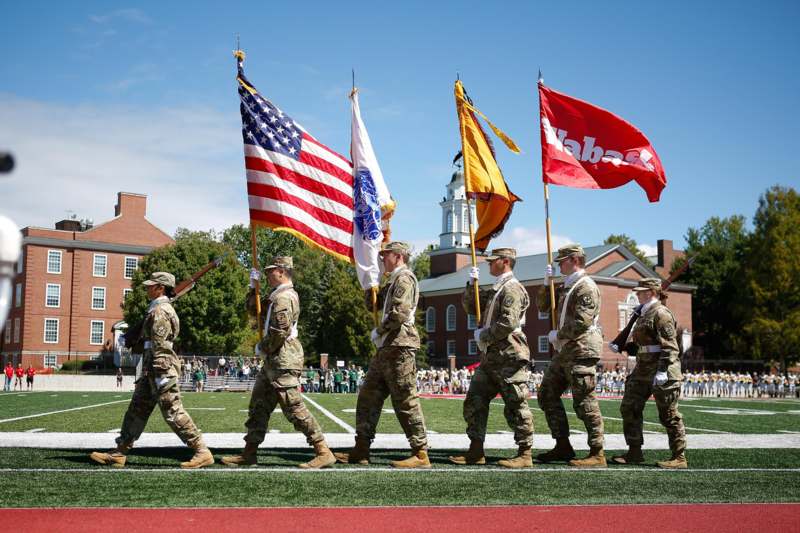 a group of soldiers marching in a parade