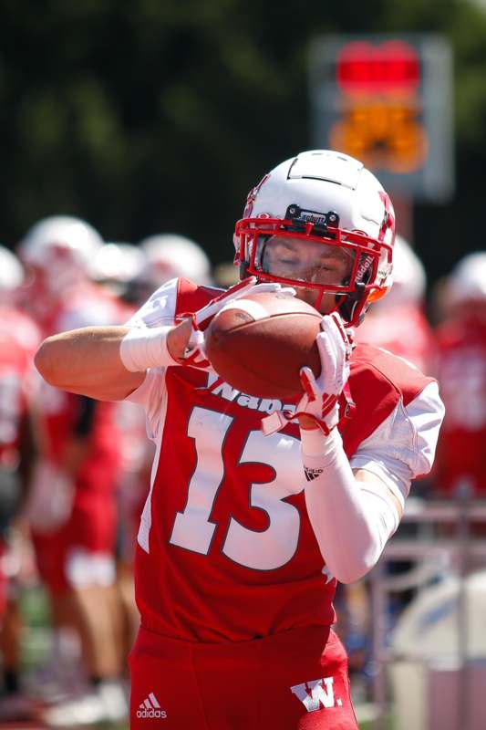 a football player holding a football