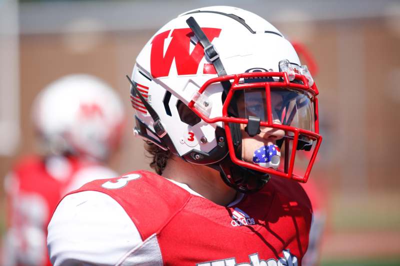 a football player wearing a helmet