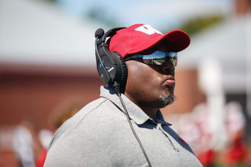 a man wearing headphones and sunglasses