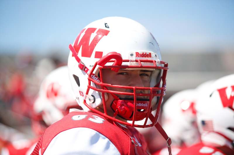 a football player wearing a helmet