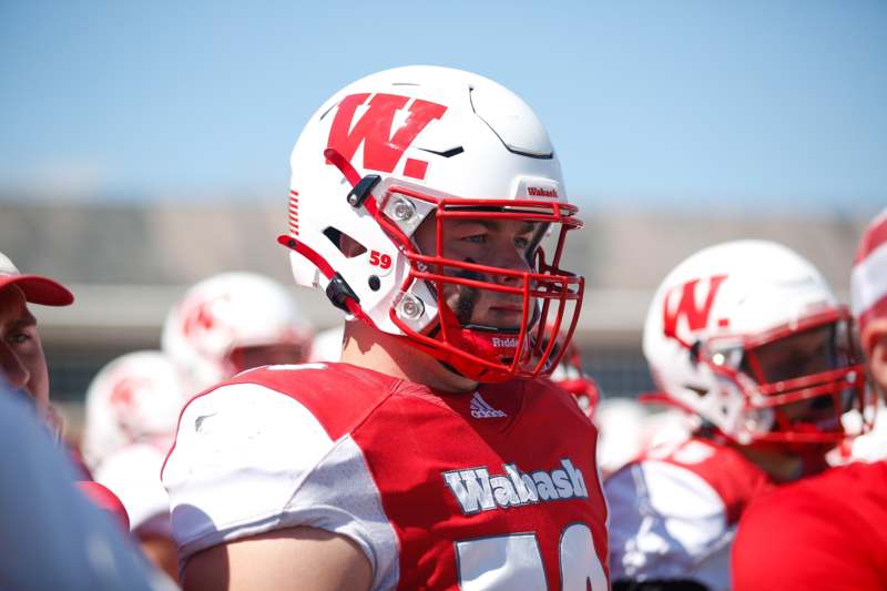 a football players wearing helmets