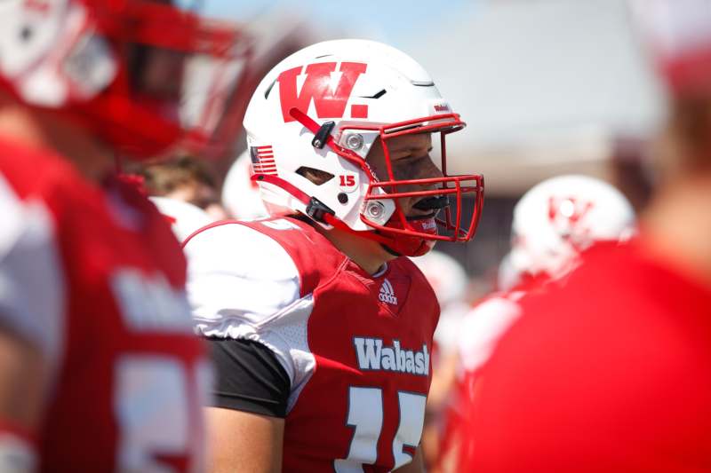 a football player in a red and white uniform