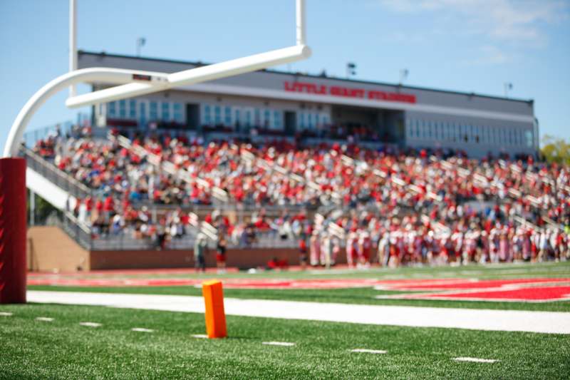 a football field with people in the background