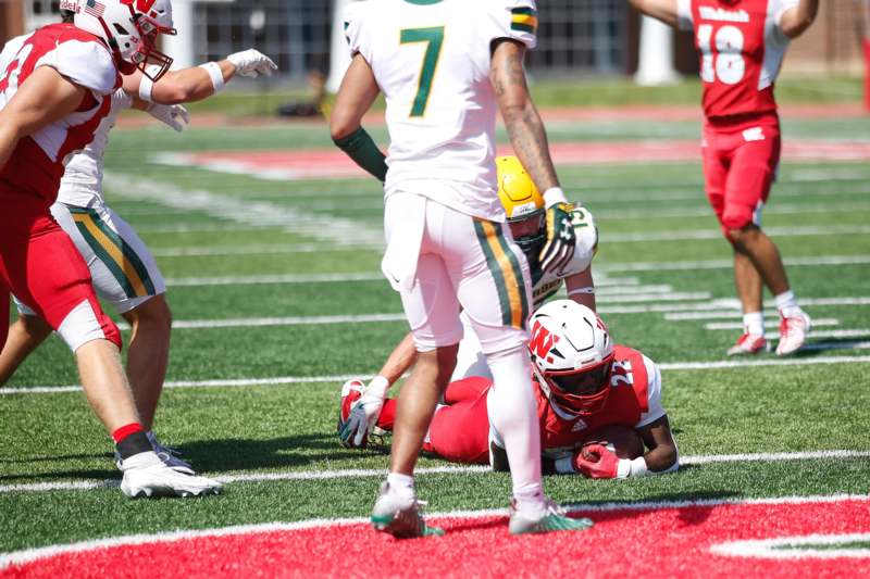 a football player falling on the ground