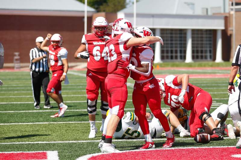 a group of football players on a field