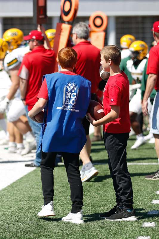 a boy holding a football