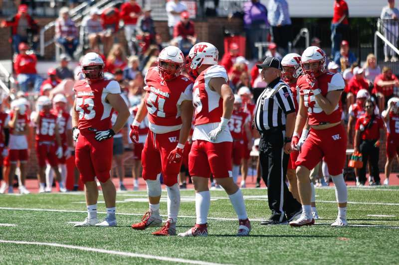 a group of football players on a field