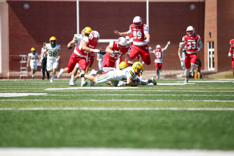 a football player falling down to the ground