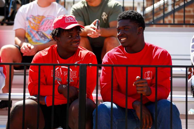 two men sitting next to each other