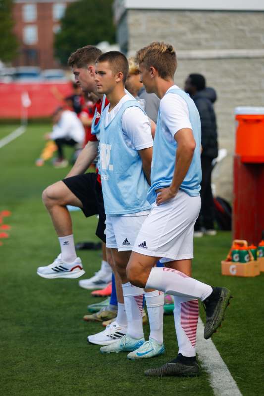 a group of men in sports uniforms