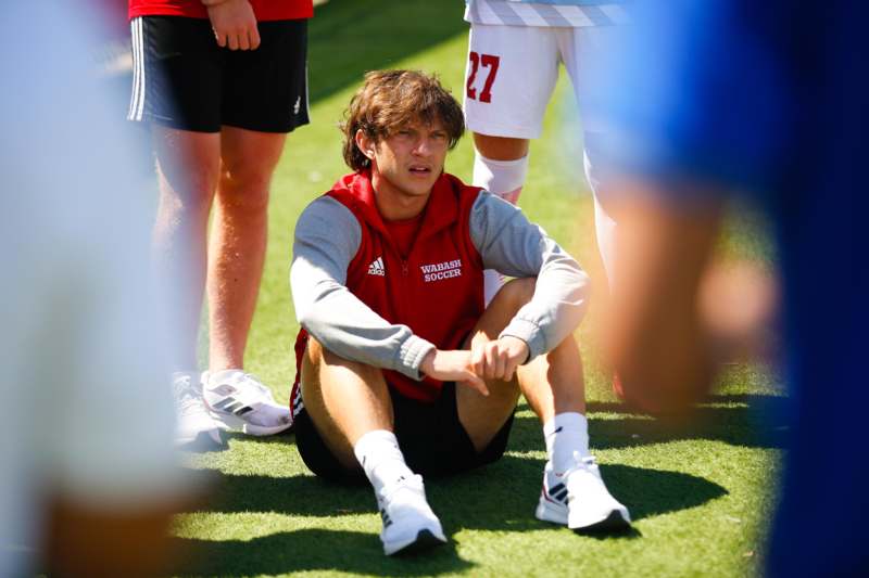 a man sitting on the ground