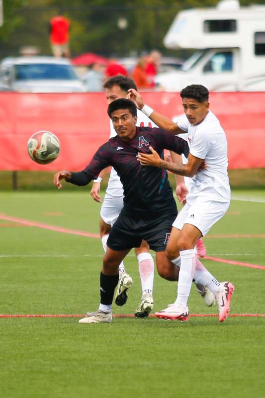 a group of men playing football