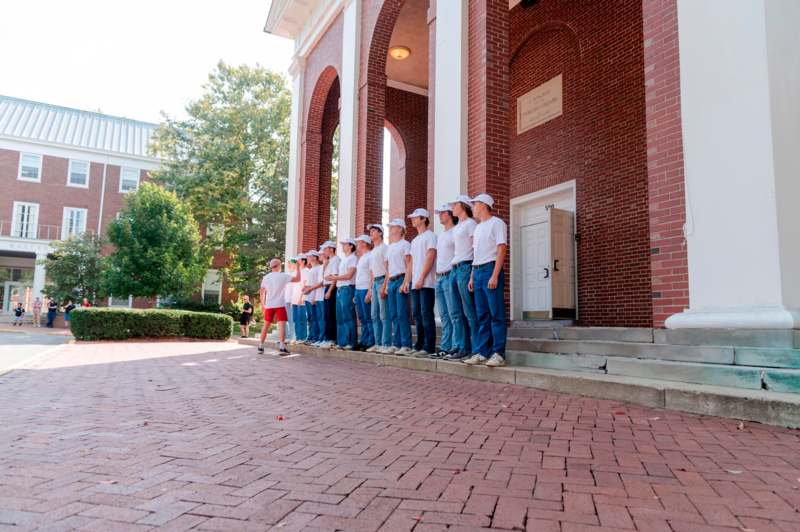 a group of people standing in a line