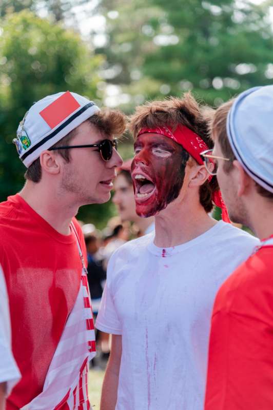 a group of men with face paint