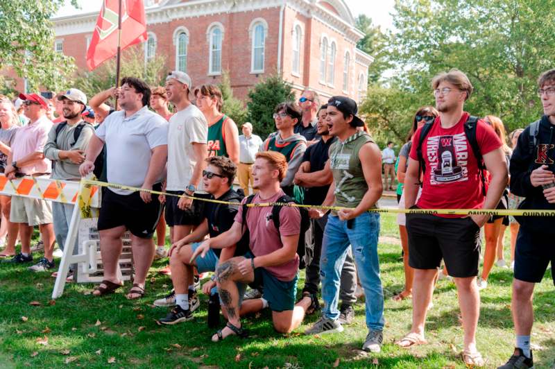 a group of people standing in a line