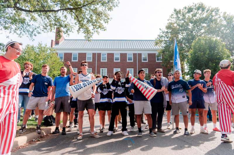 a group of people standing in front of a building