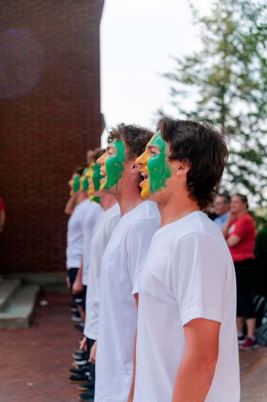 a group of men with paint on their faces