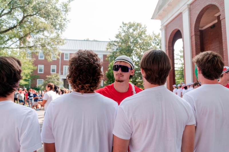 a group of people standing in front of a building